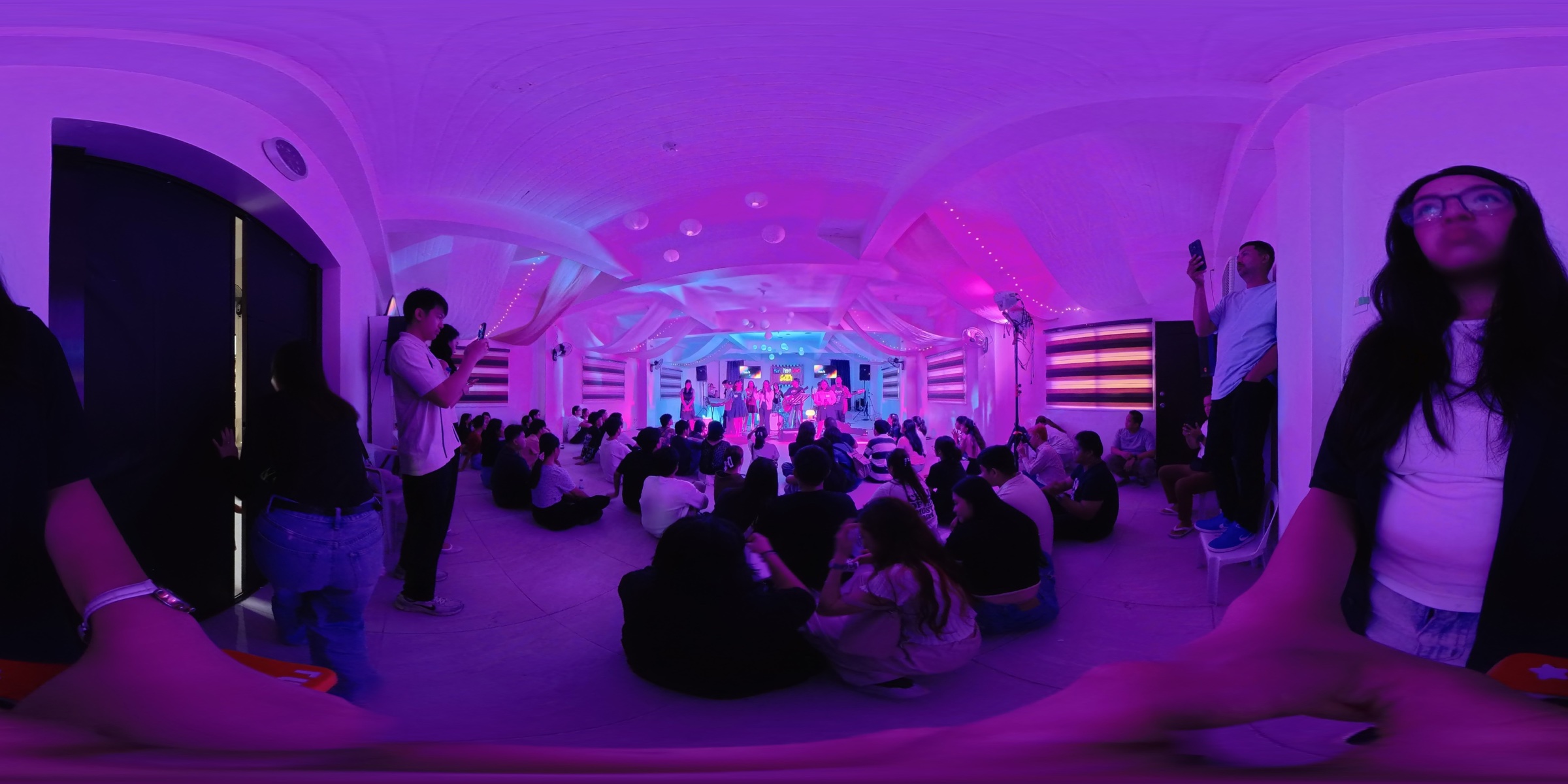 A wide view of everyone gathered around the Ignite 2025 stage